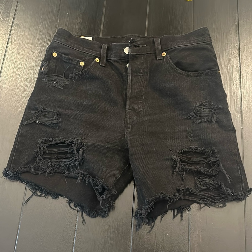Levis 501s distressed long cut black denim shorts